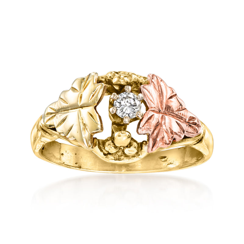 Two-tone gold leaf ring with round diamond center and raised textured leaves