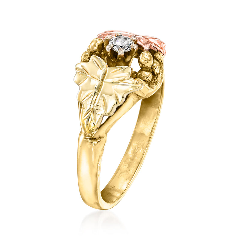 Gold two-tone leaf ring with bezel-set round diamond and sculpted leaf cluster