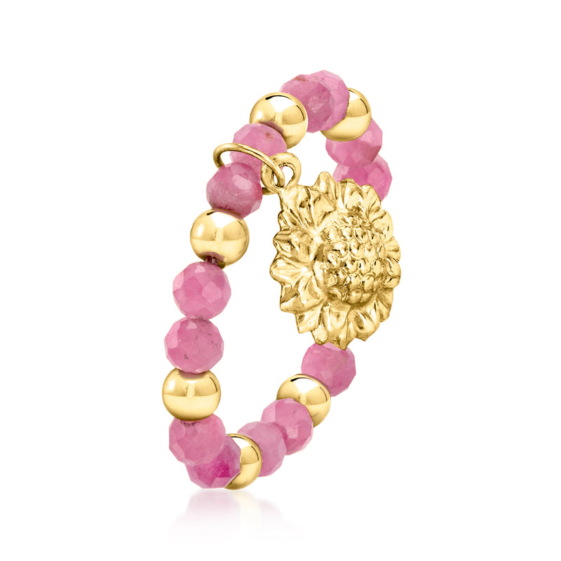 Pink tourmaline bead stretch ring with gold sunflower charm, side view