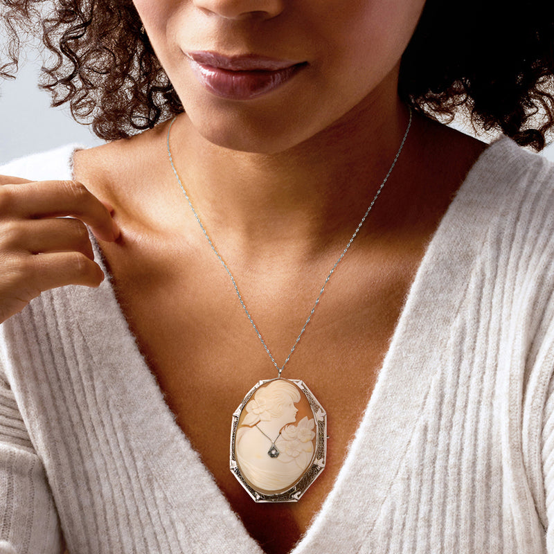 Worn vintage orange shell cameo pendant on chain, 14kt white gold with diamond