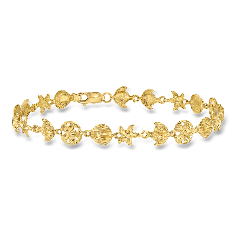 14kt yellow gold sea life charm bracelet with starfish, shell, and fish motifs