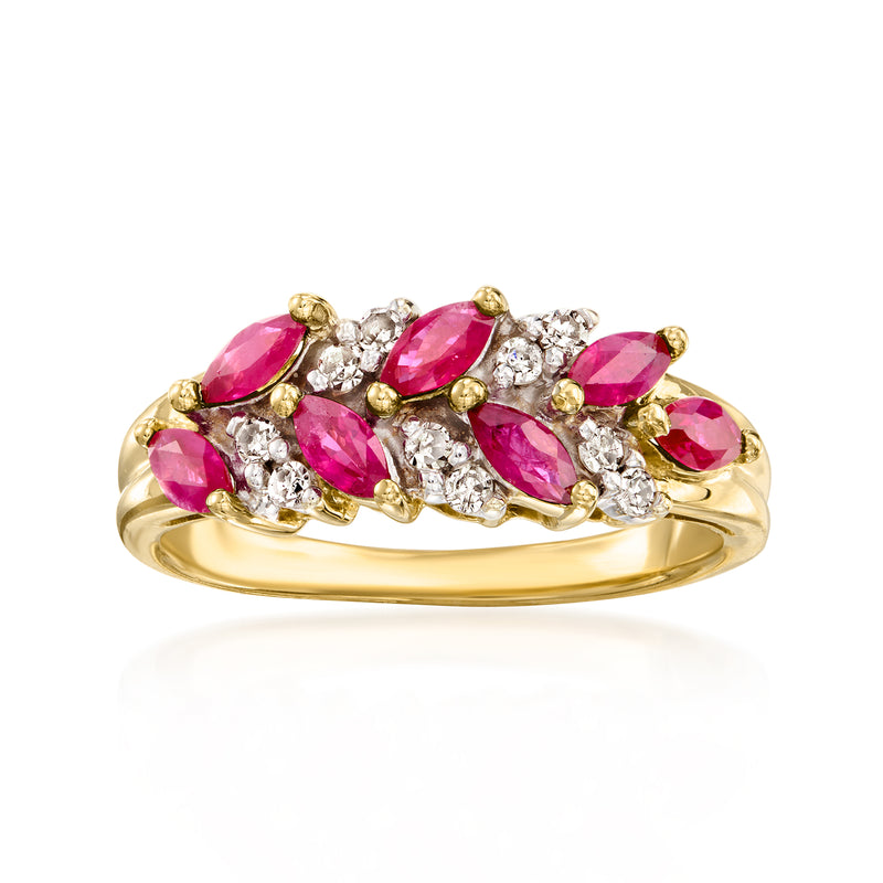 Yellow gold chevron ring with pink marquise ruby stones and diamond cluster accents