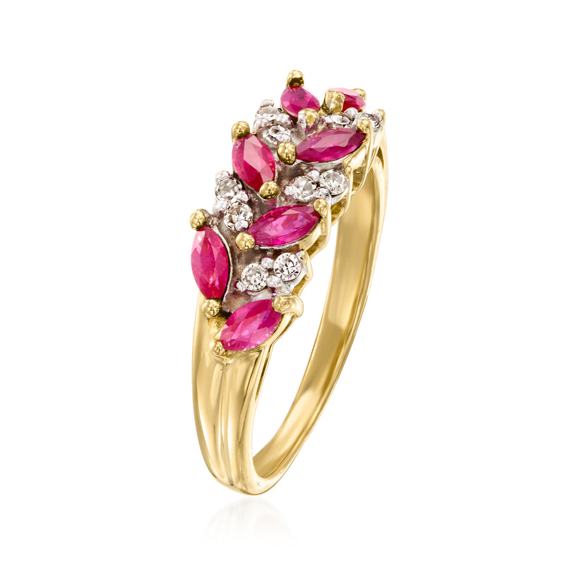 Yellow gold chevron ring with oval pink ruby stones and round diamond halo accents