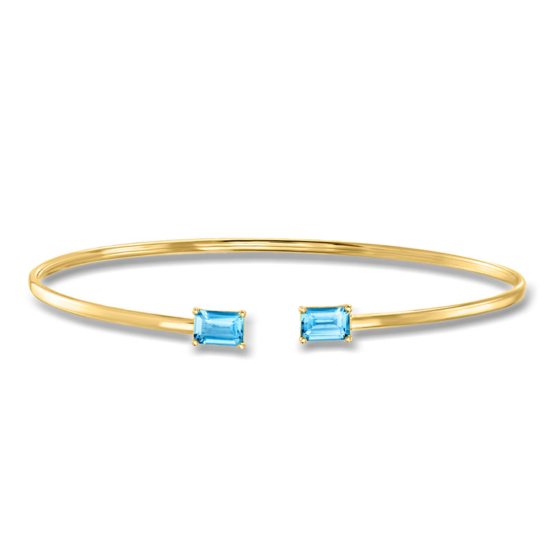 14kt yellow gold cuff bracelet with two square Swiss-blue topaz stones