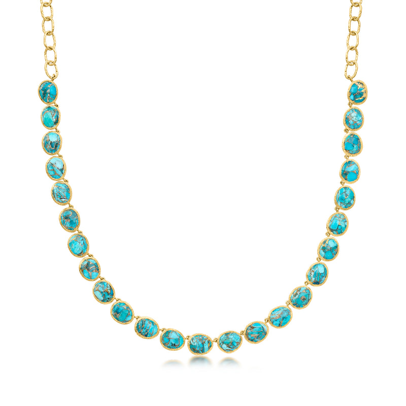 Gold necklace with oval turquoise-colored cabochon stones in linked chain