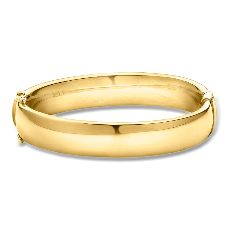 Polished gold-tone bangle bracelet with smooth oval profile and hinge detail