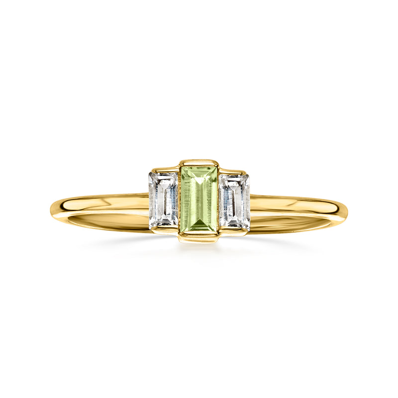 Yellow gold ring with emerald-cut peridot-green center and baguette white topaz sides