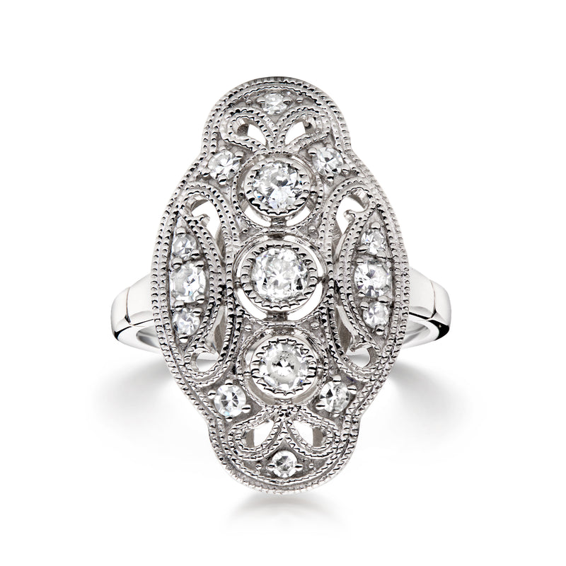 Platinum filigree diamond ring with oval center and round side stones