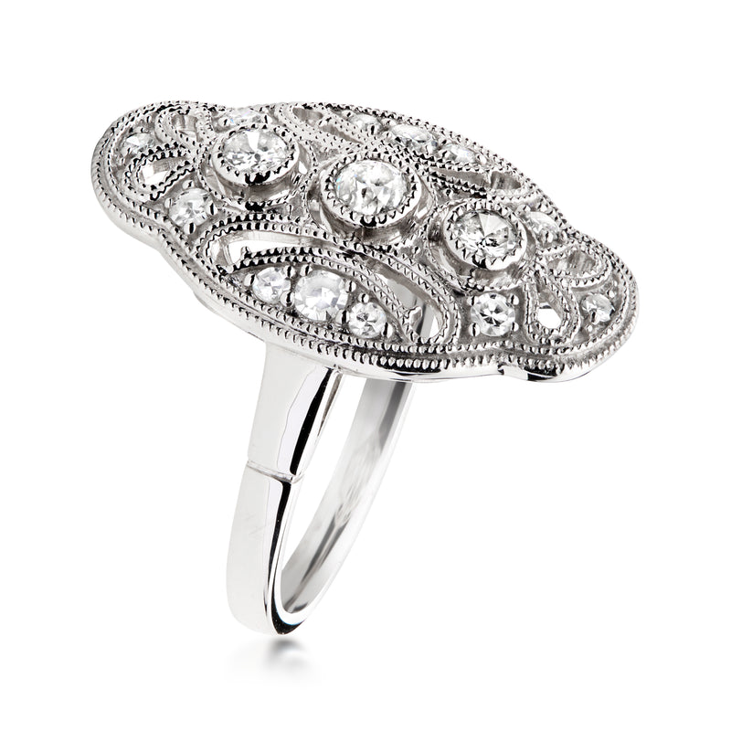 Platinum filigree diamond ring side view with scalloped, ornate openwork
