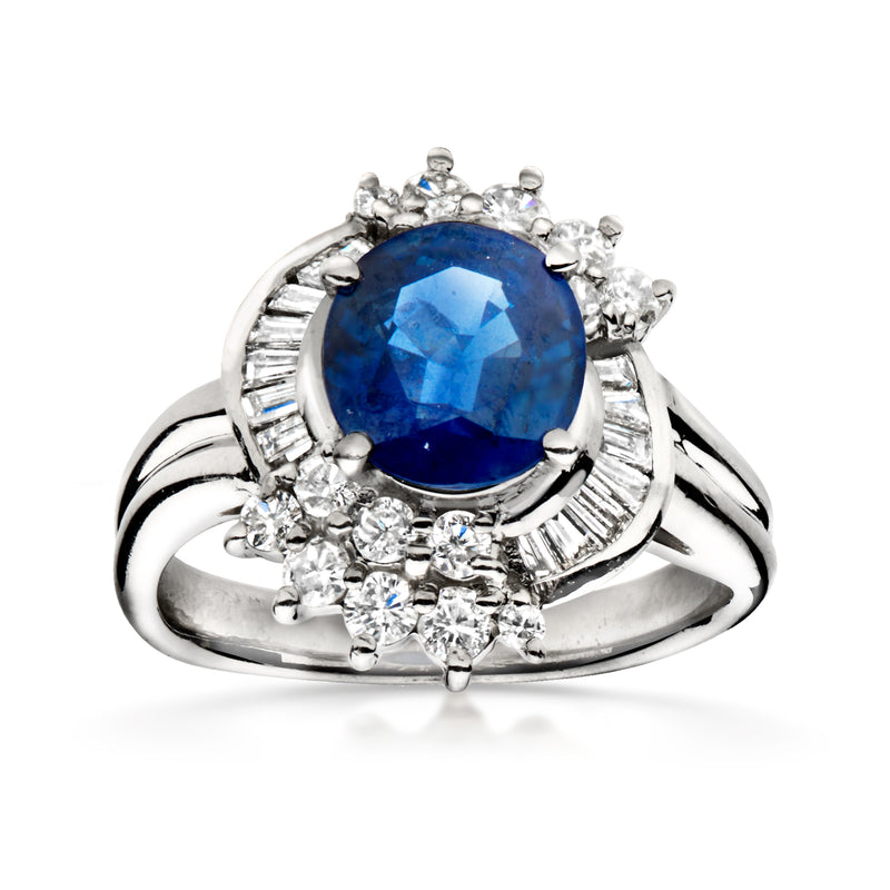 Platinum ring with blue sapphire center and diamond accents