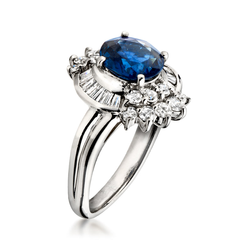 Platinum sapphire and diamond ring with oval blue center stone