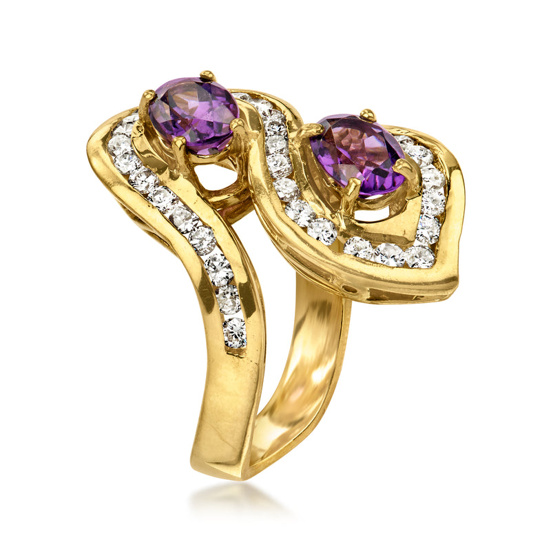 Yellow gold bypass ring with two purple oval amethysts and diamond accents, open setting