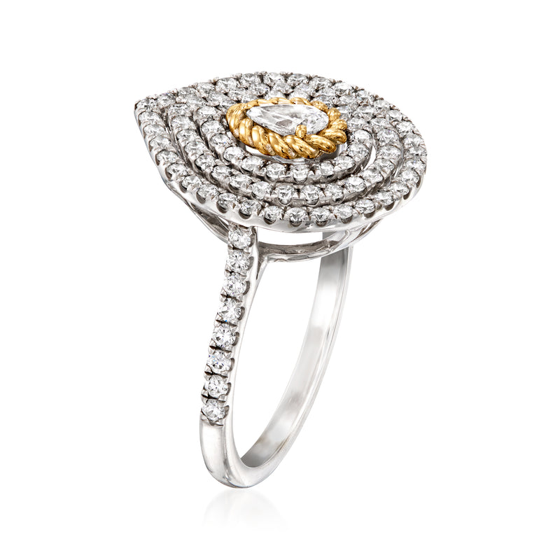Two-tone diamond ring with pear center, halo of small stones and gold twist detail