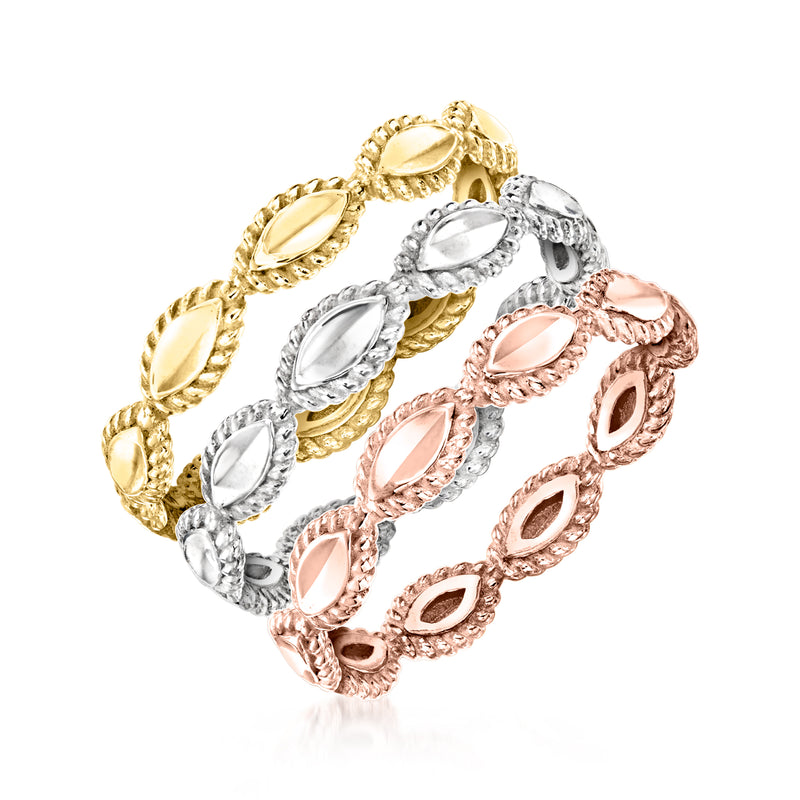 Three stackable rings in gold, silver, and rose tones with oval center stones