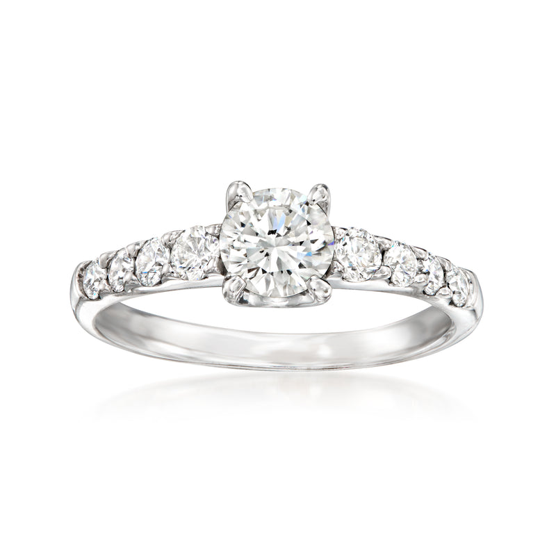Vintage diamond ring in 18kt white gold with round center stone and pavé band