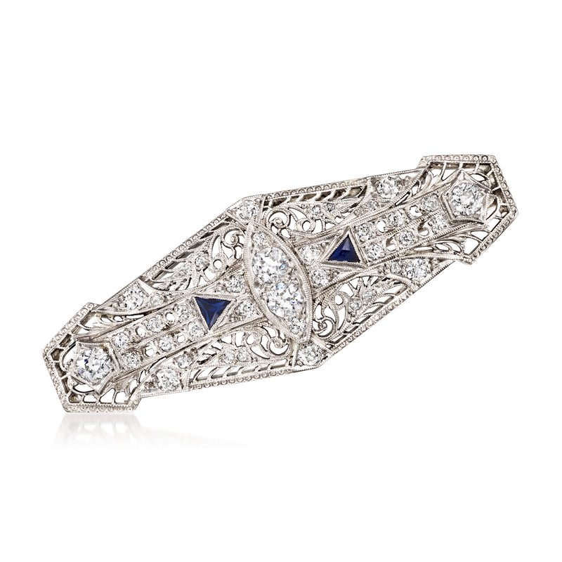 Vintage platinum openwork diamond pin with blue triangular stones, filigree frame