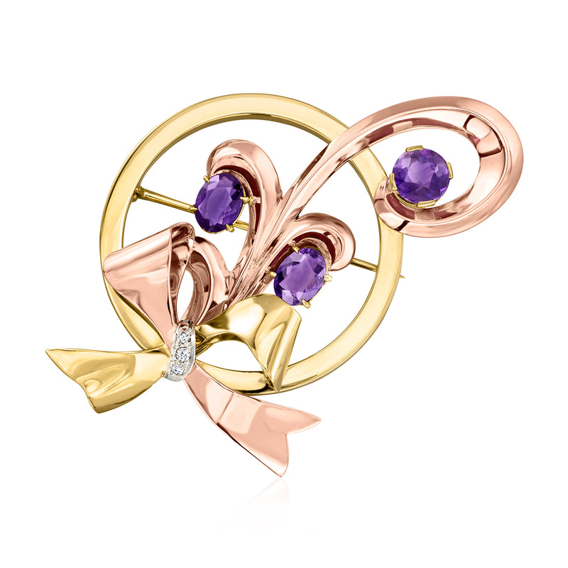 Tri-colored gold floral bow pin with oval amethyst stones and diamond accents