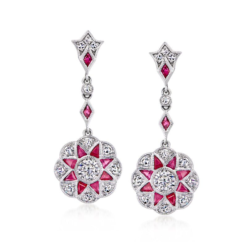 Platinum drop earrings with ruby accents and diamond halo flower clusters