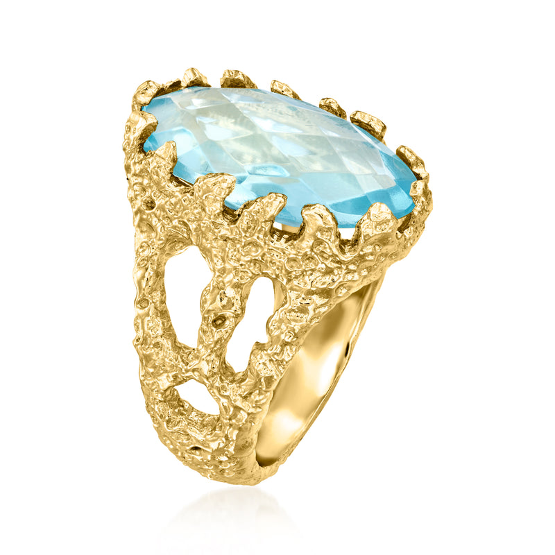 Gold-plated ring with large oval simulated blue gemstone and openwork textured band