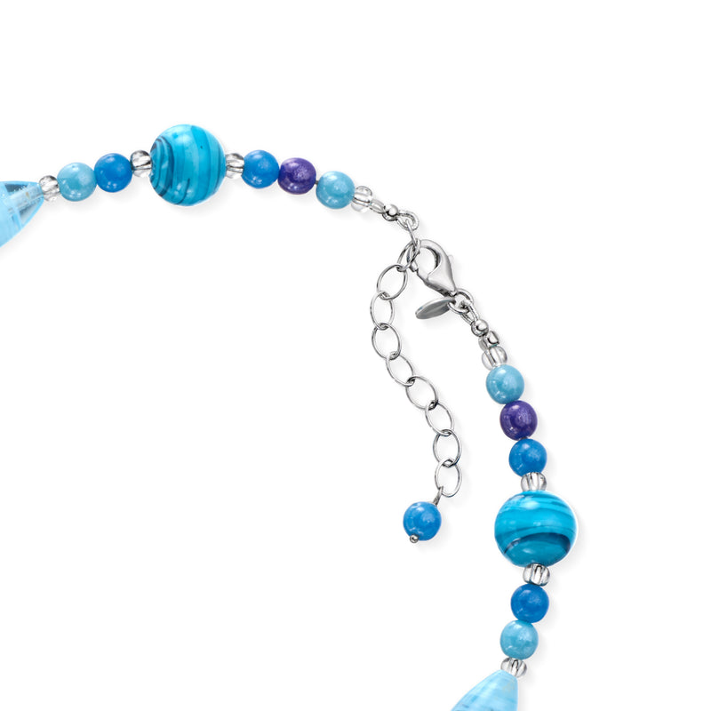 Close-up of blue Murano glass beads with sterling silver chain and extender links