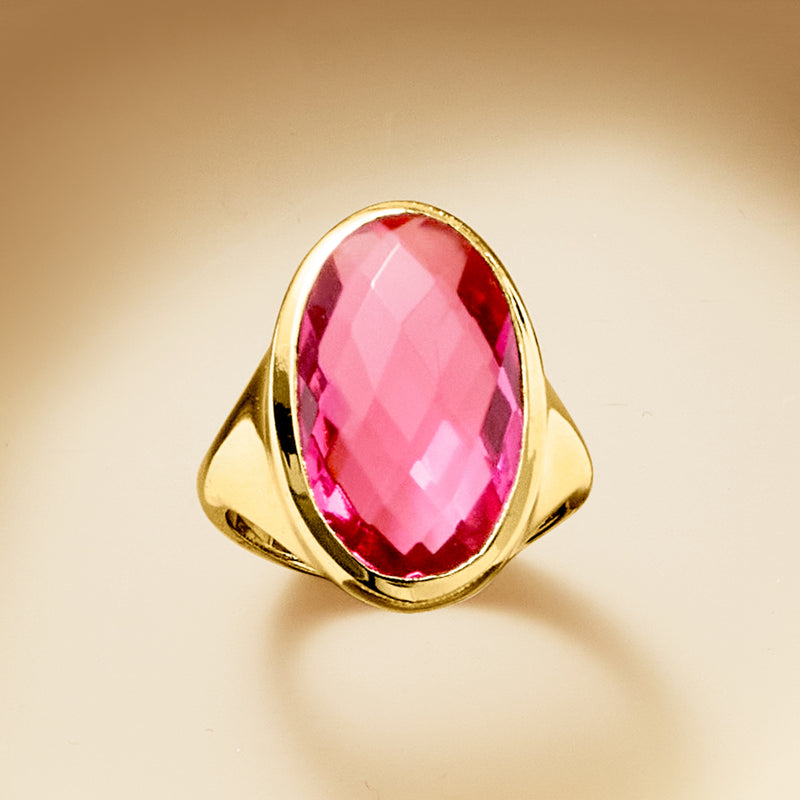 Yellow gold-plated ring with oval magenta-pink simulated tourmaline gemstone