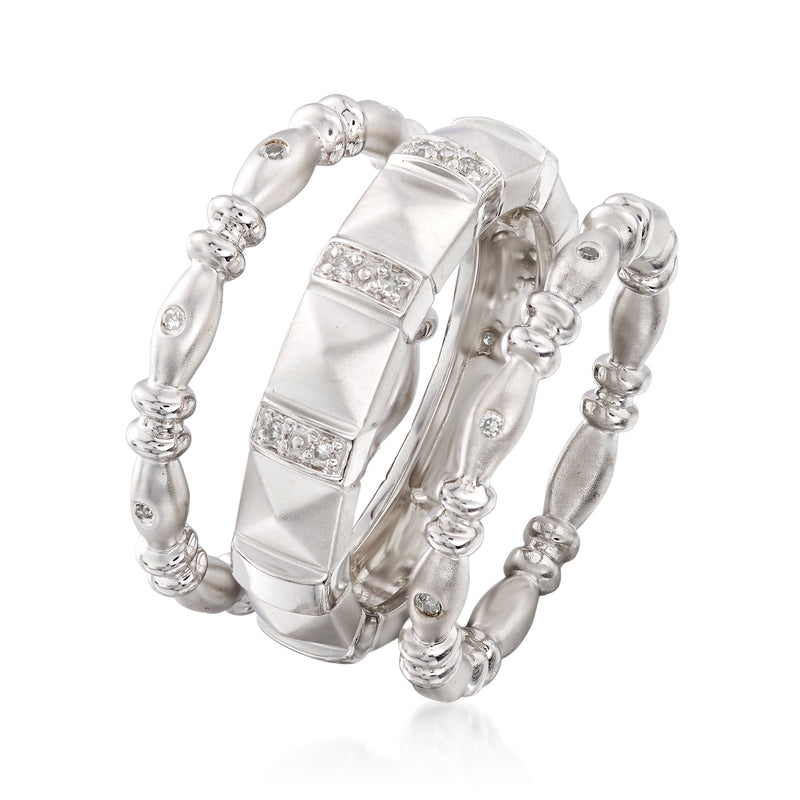 Three sterling silver stackable eternity bands with diamond accents, angled view