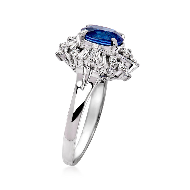 Platinum sapphire and diamond ring, oval blue gemstone in ornate prong setting