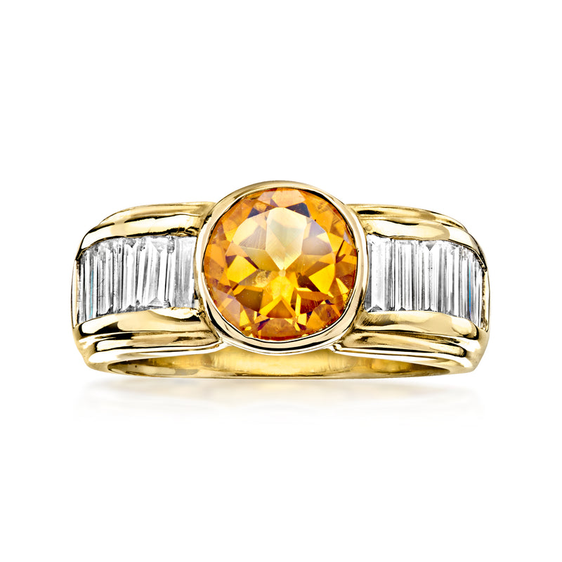 18kt yellow gold ring with oval citrine center and baguette diamond side stones