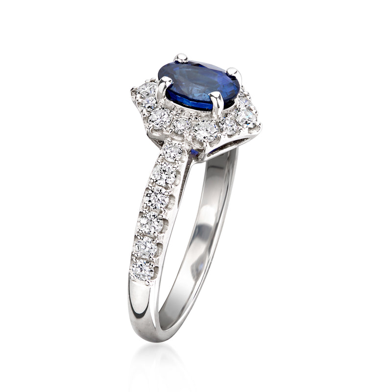 Platinum sapphire and diamond ring with halo and pavé band