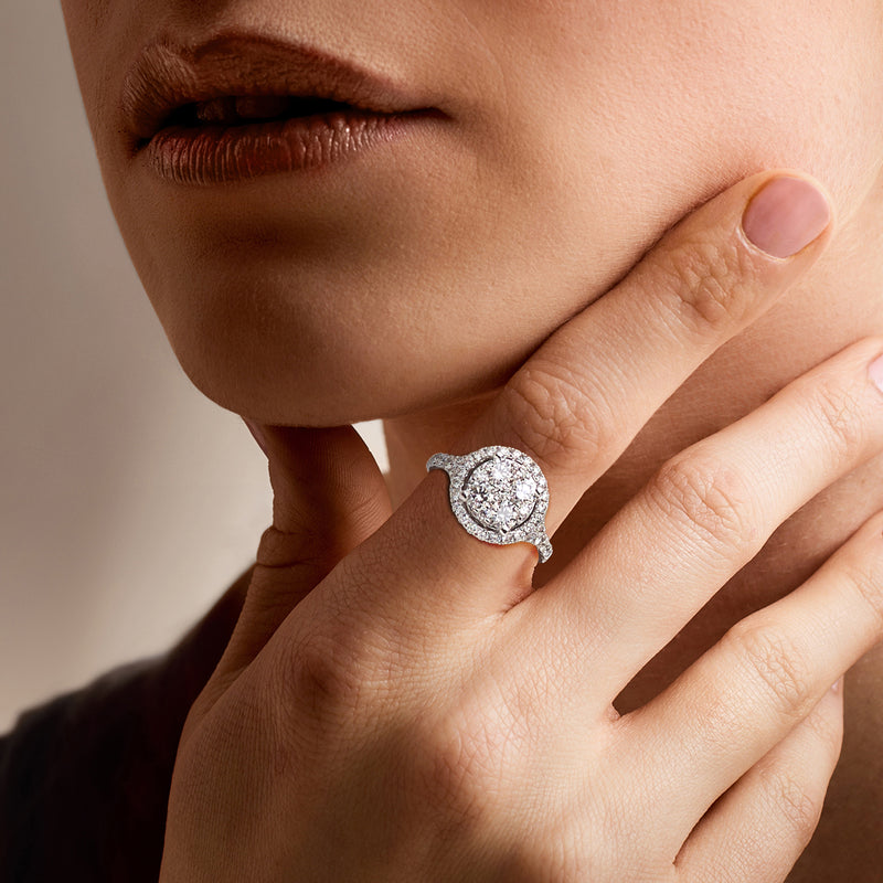 Vintage diamond cluster ring in 14kt white gold on finger