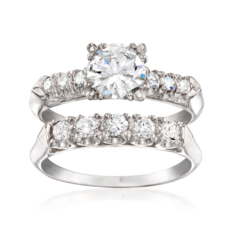 Platinum diamond engagement ring with large center stone and matching diamond band