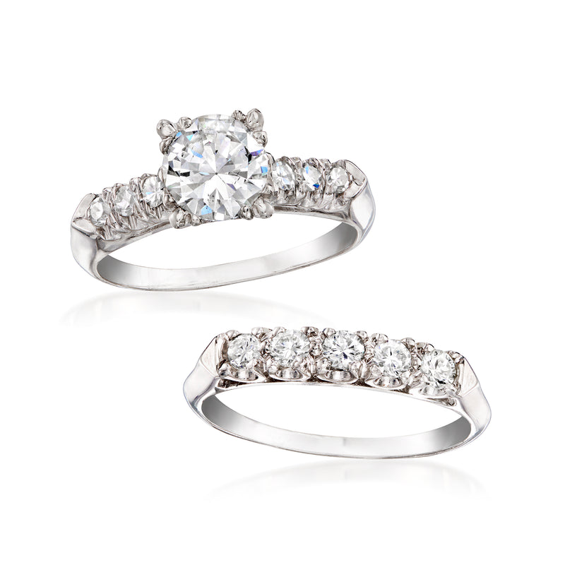 Two platinum diamond rings: one with large center stone, one with a row of stones