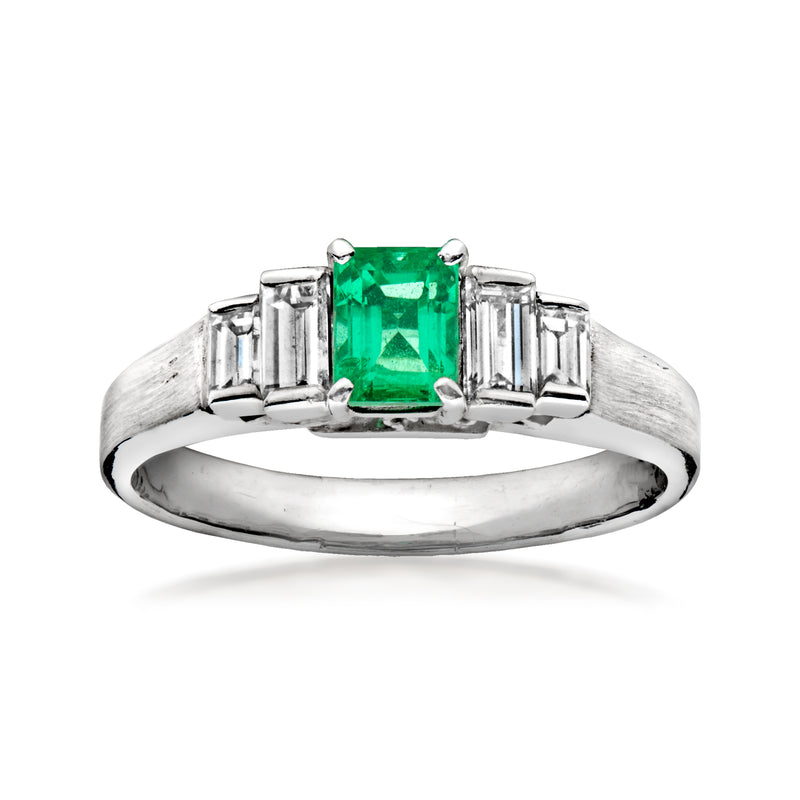 Platinum vintage-style ring with square emerald-cut green center stone and baguette sides