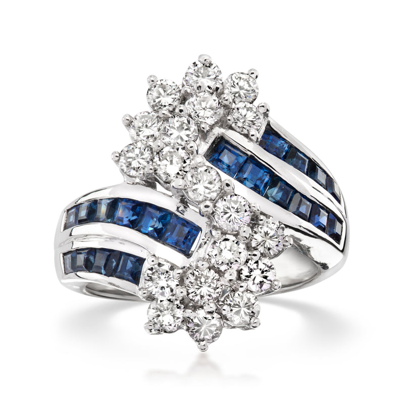 Platinum bypass ring with blue sapphire marquise bands and round diamond cluster accents