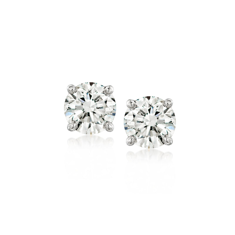 Platinum round diamond stud earrings with four-prong settings and small halo accents