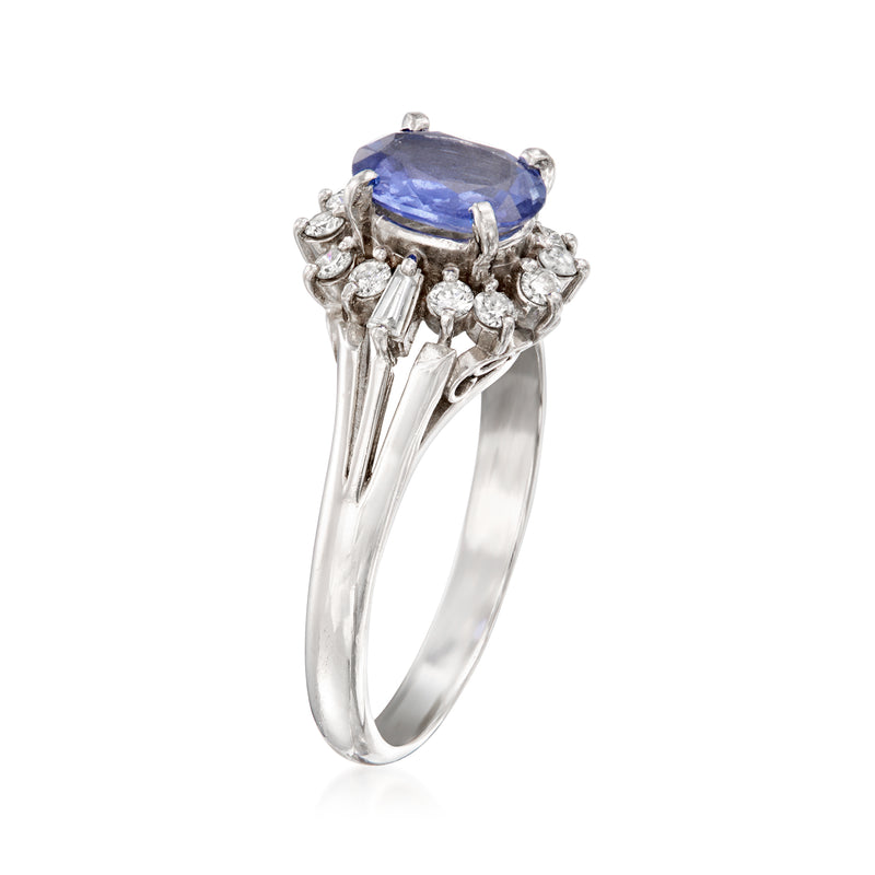 Platinum vintage ring with oval blue sapphire and diamond cluster setting