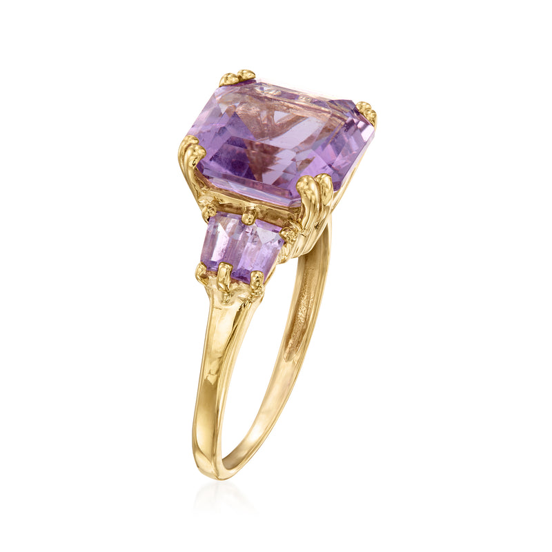 Amethyst ring with cushion-cut center stone and side stones in 14kt yellow gold