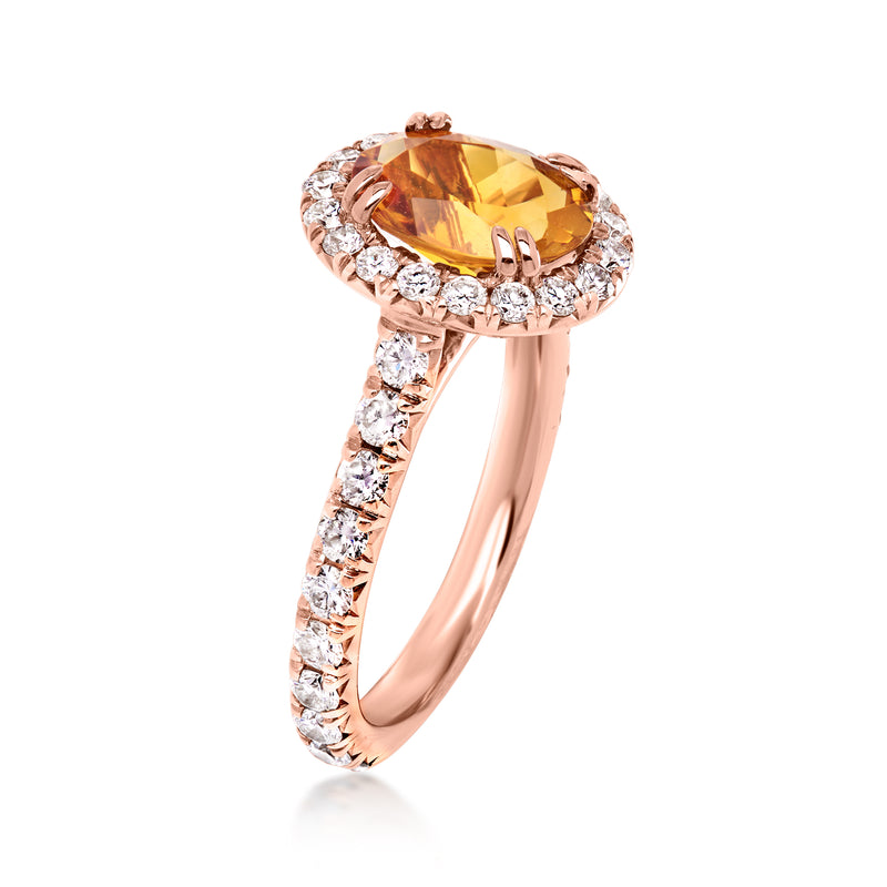 Rose gold ring with oval citrine center and diamond halo, diamond band