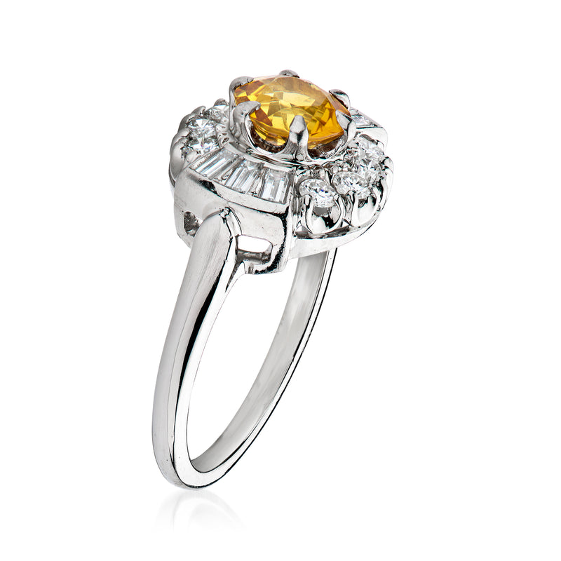 Platinum citrine ring with halo of round diamonds and raised prongs