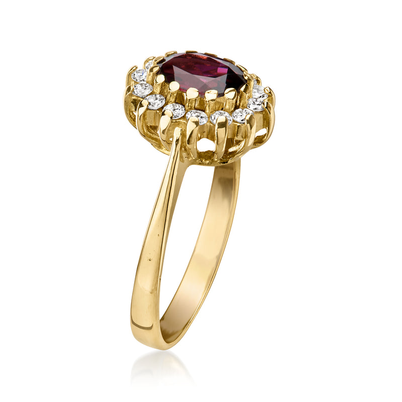18kt yellow gold garnet ring with diamond halo and oval center stone