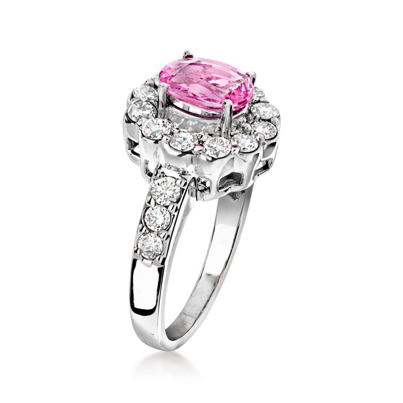 Vintage pink sapphire oval ring with split diamond accents on white gold band.