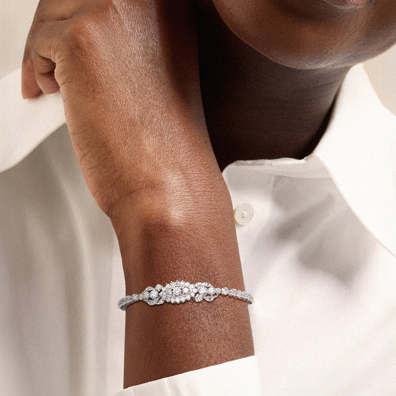 Diamond bracelet on wrist with sparkling oval and round-cut links in white gold
