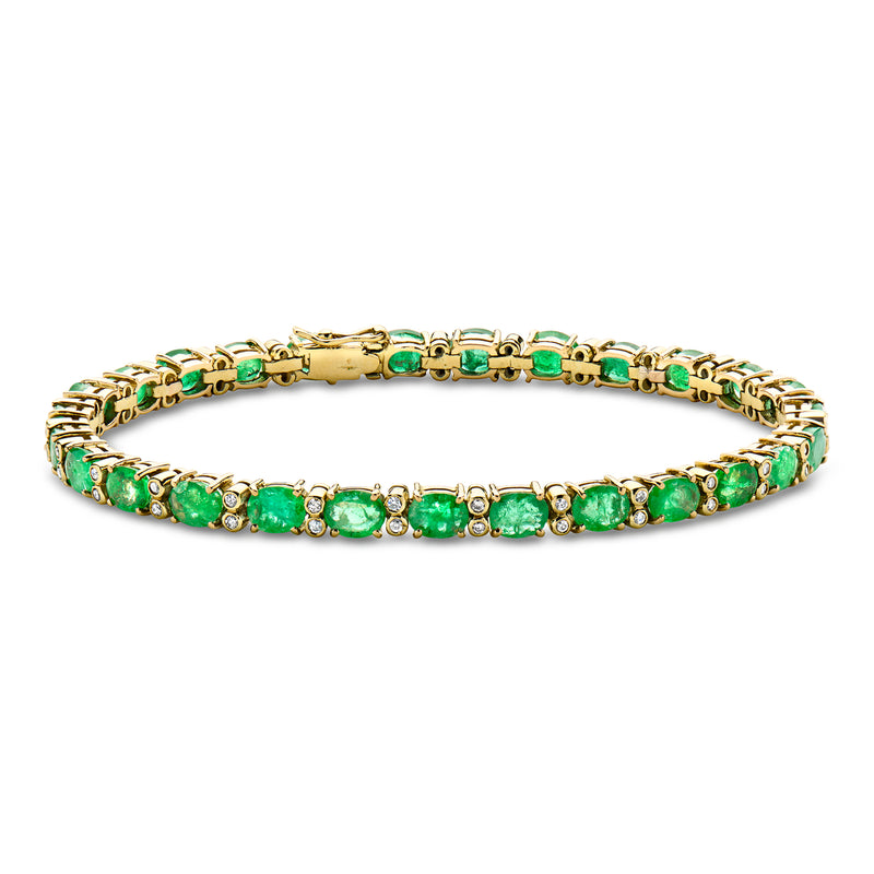 Vintage emerald and diamond tennis bracelet in yellow gold with green stones and diamond accents