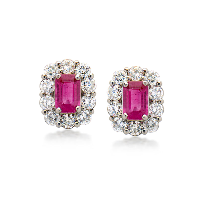 Platinum ruby and diamond stud earrings with rectangular-cut ruby in diamond halo