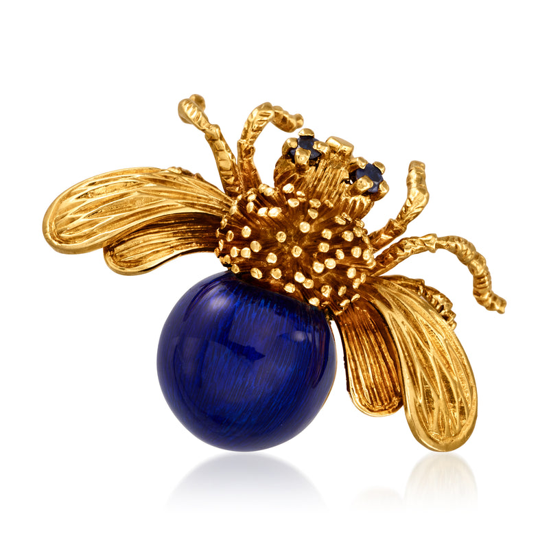 Gold-tone bee lapel pin with dark blue enamel body and tiny gem accents