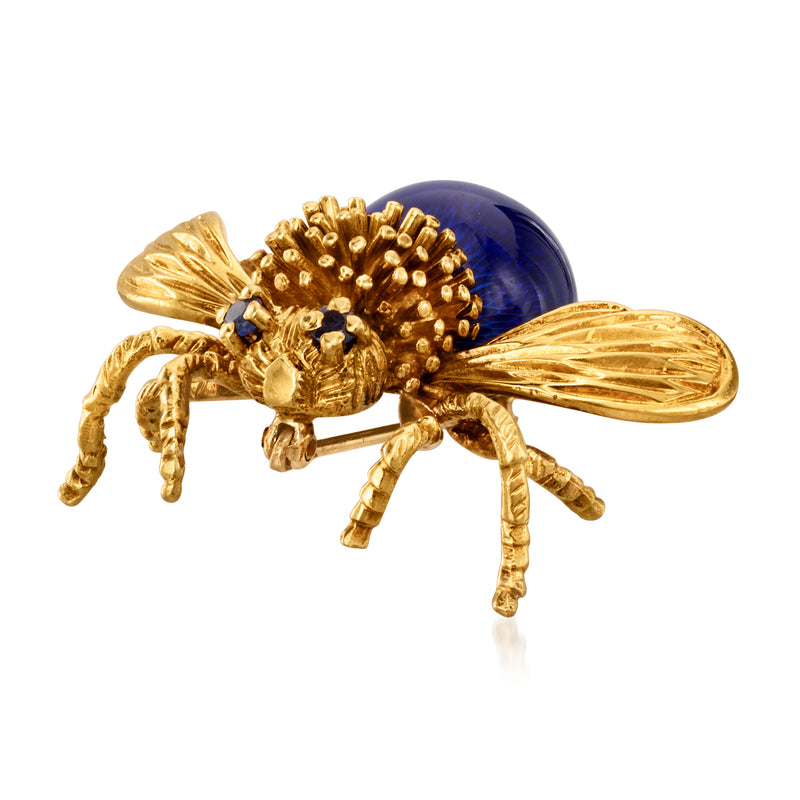 Gold-tone bumblebee pin with dark blue enamel oval body and sparkling rhinestone accents