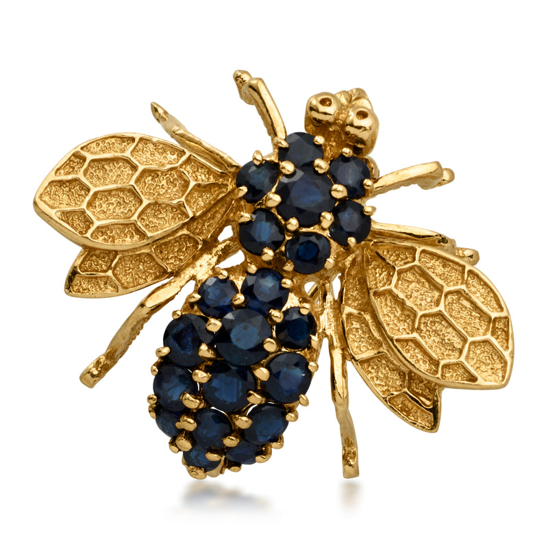Vintage bee pin in 14kt yellow gold with dark blue sapphire cluster stones