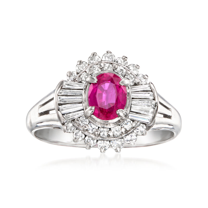 Platinum ruby ring with oval pink center stone and diamond halo