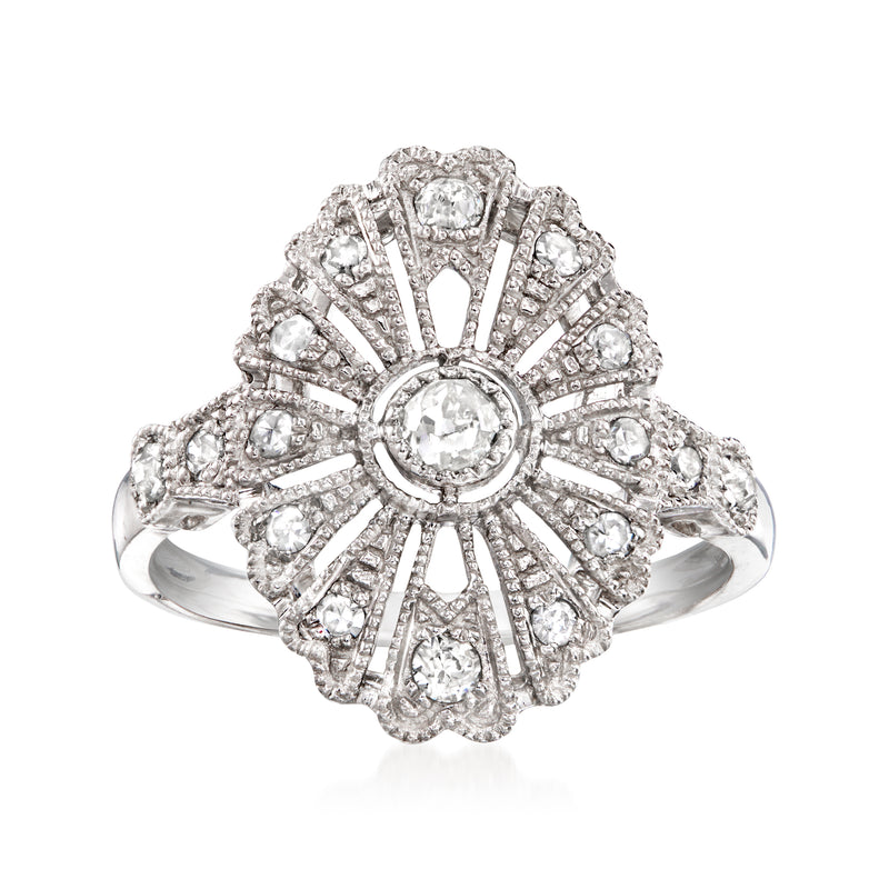 Platinum diamond filigree vintage-style ring with central round stone and halo