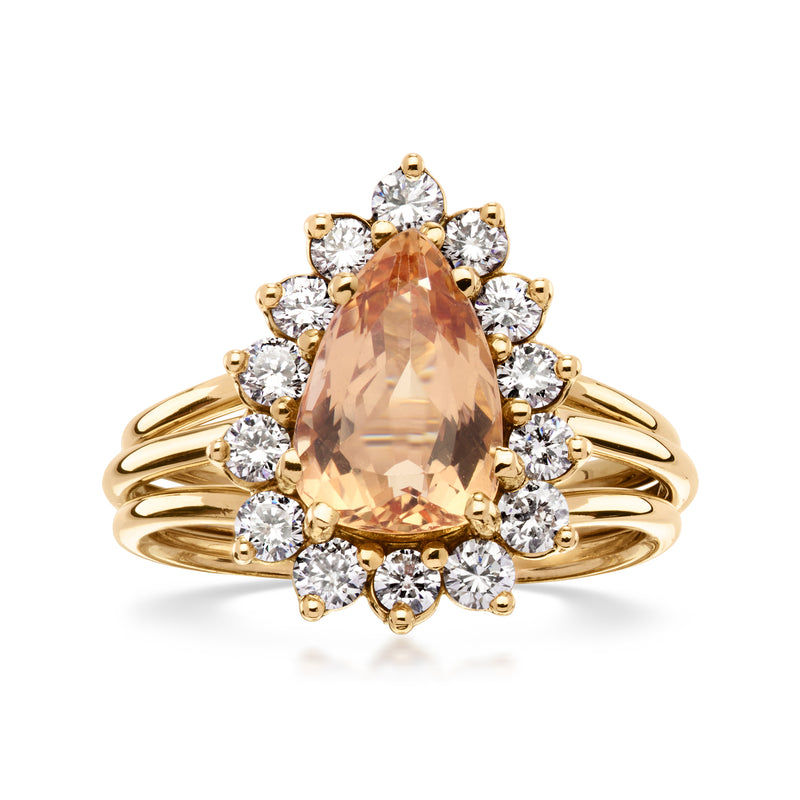 14kt yellow gold ring with pear orange topaz center and round diamond halo